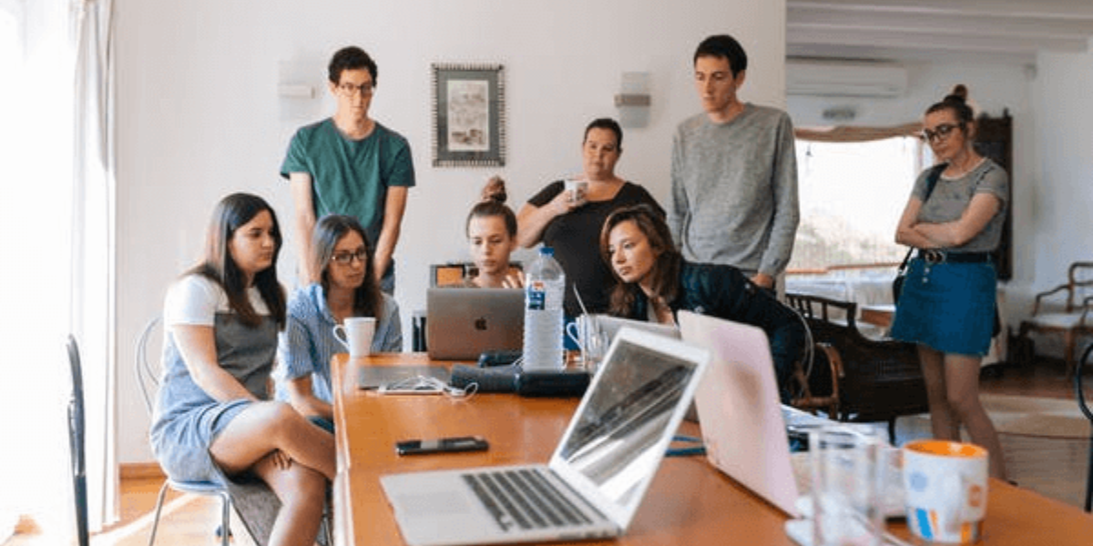 A diverse team engaged in a brainstorming session, collaborating and discussing creative ideas for fostering innovation and growth in the workplace.